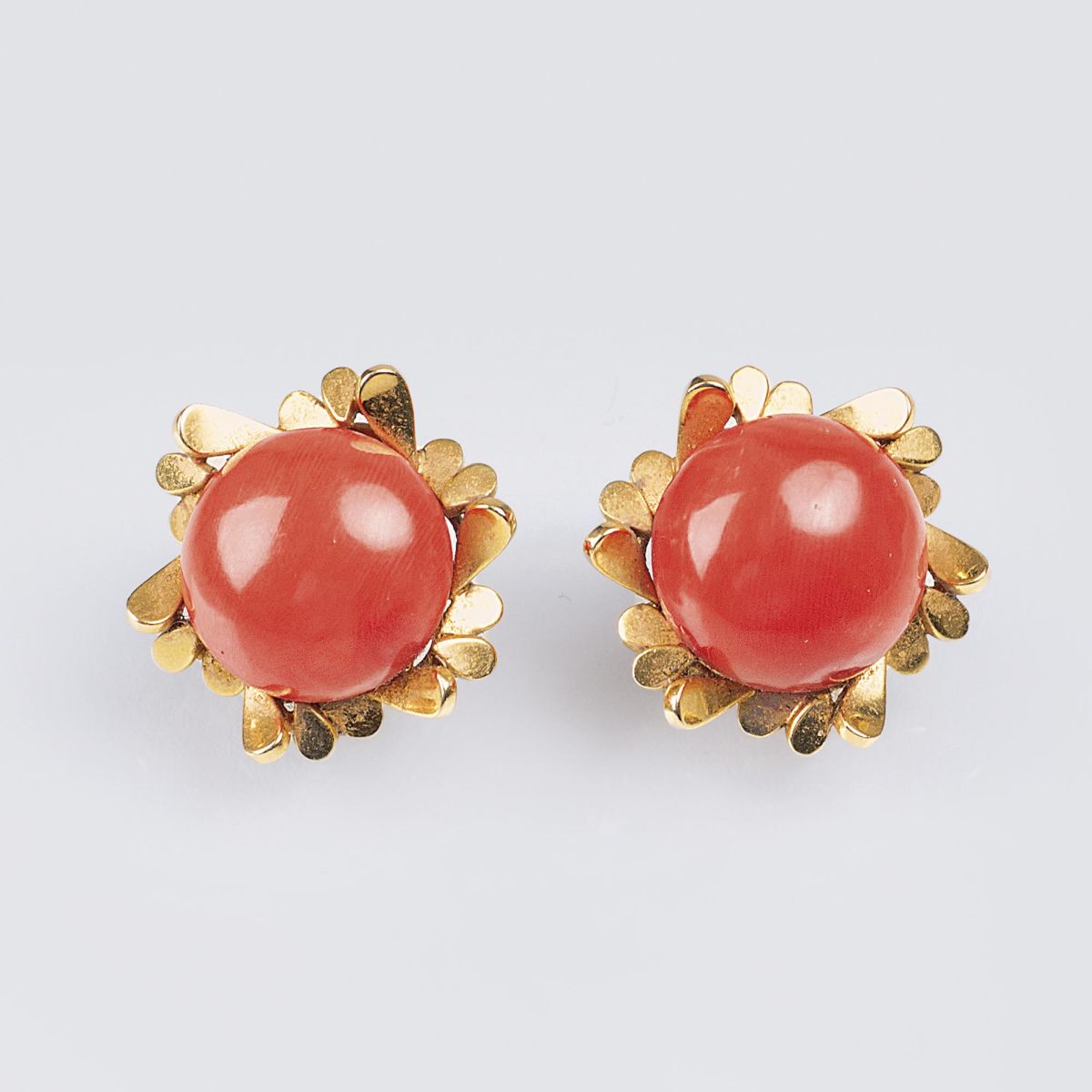 A Pair of Vintage Gold Earclips with Coral Setting