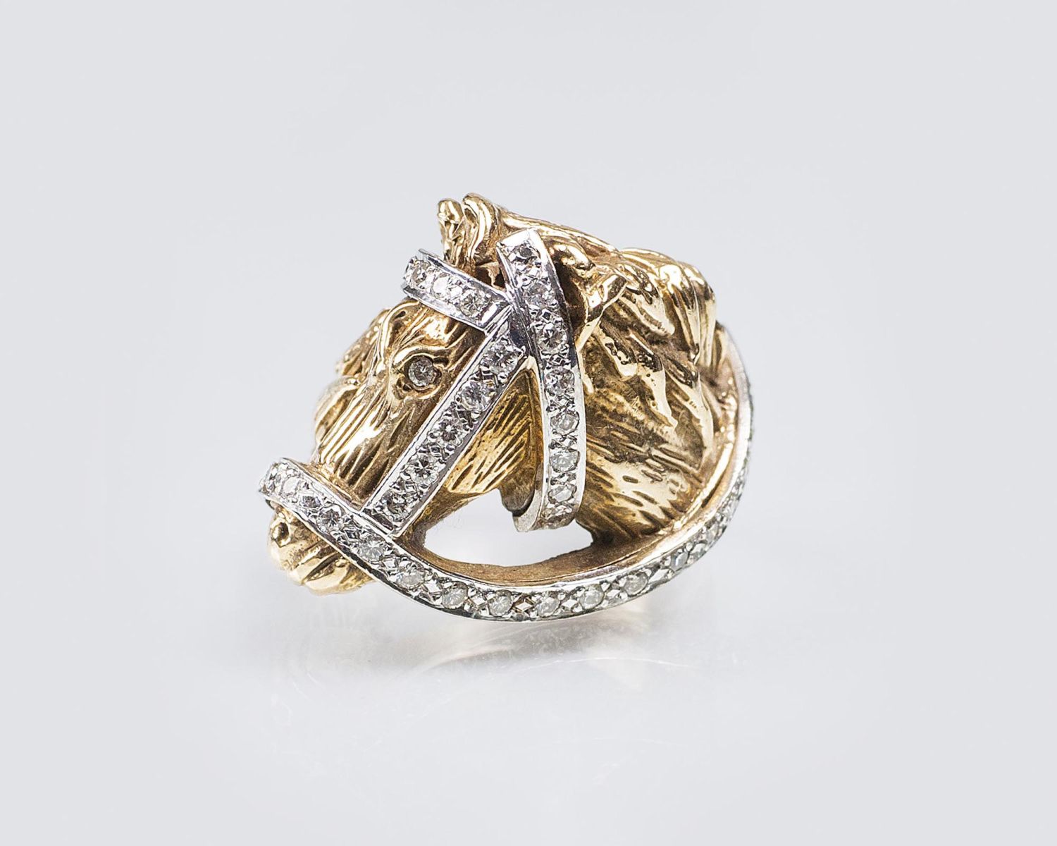 A Gold Ring 'Horse' with Diamonds