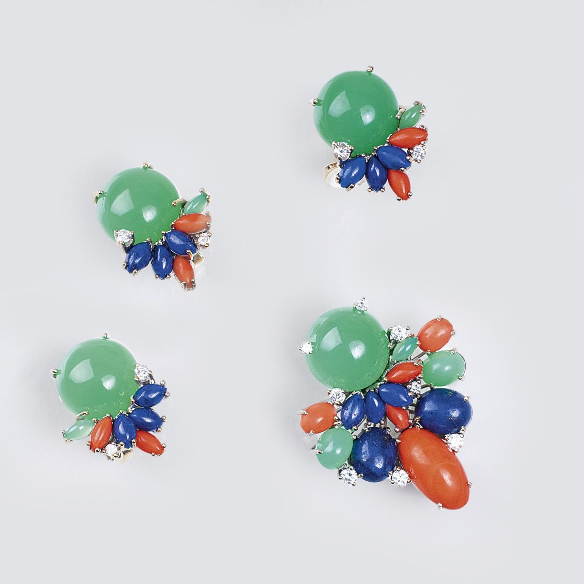 A three-piece Vintage Jewellery Set with Chrysopras, Coral, Lapis Lazuli and Diamonds A three-piece Vintage Jewellery Set with Chrysopras, Coral, Lapis Lazuli and Diamonds