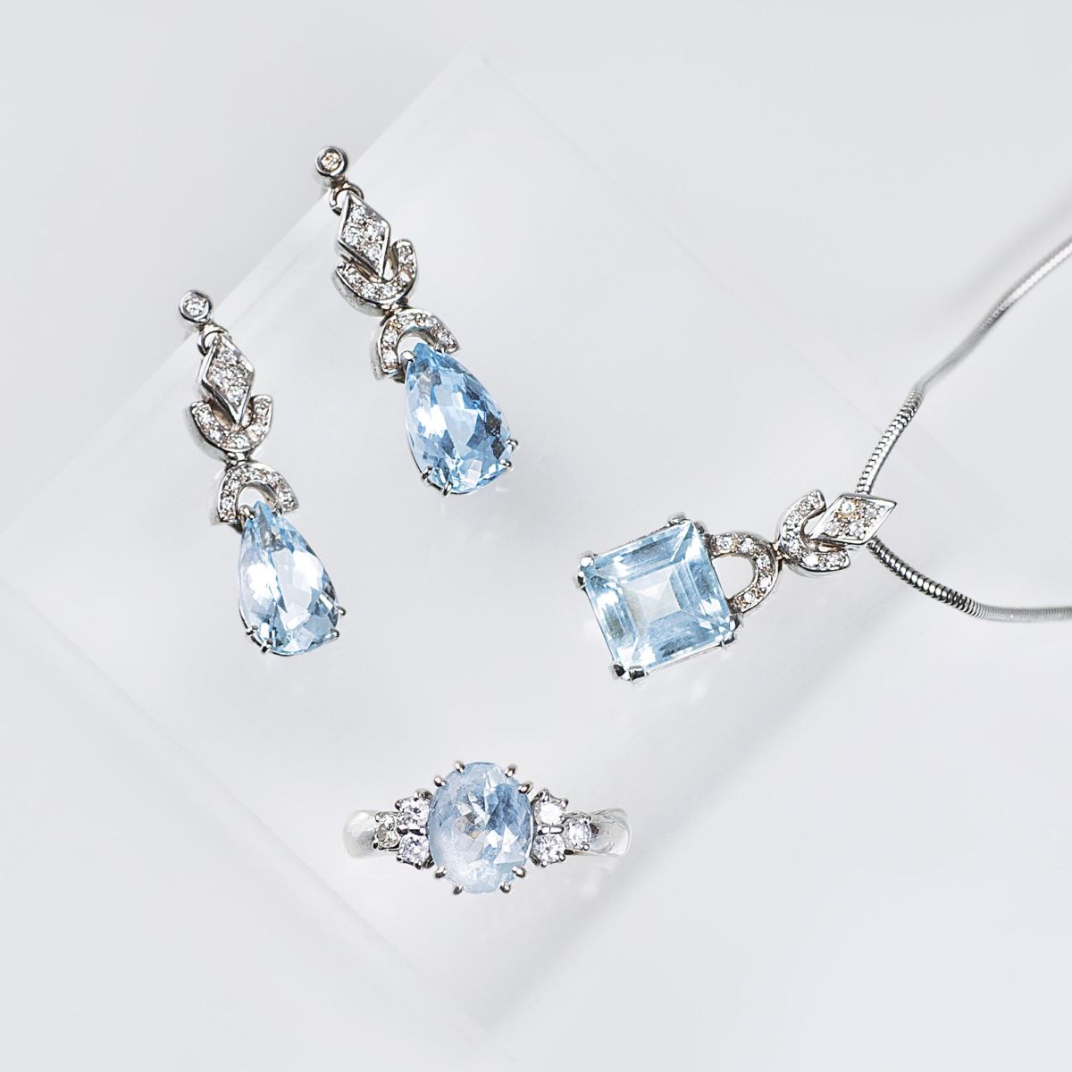 An Aquamarine Diamond Jewelry Set with ring, pendant and earrings An Aquamarine Diamond Jewelry Set with ring, pendant and earrings