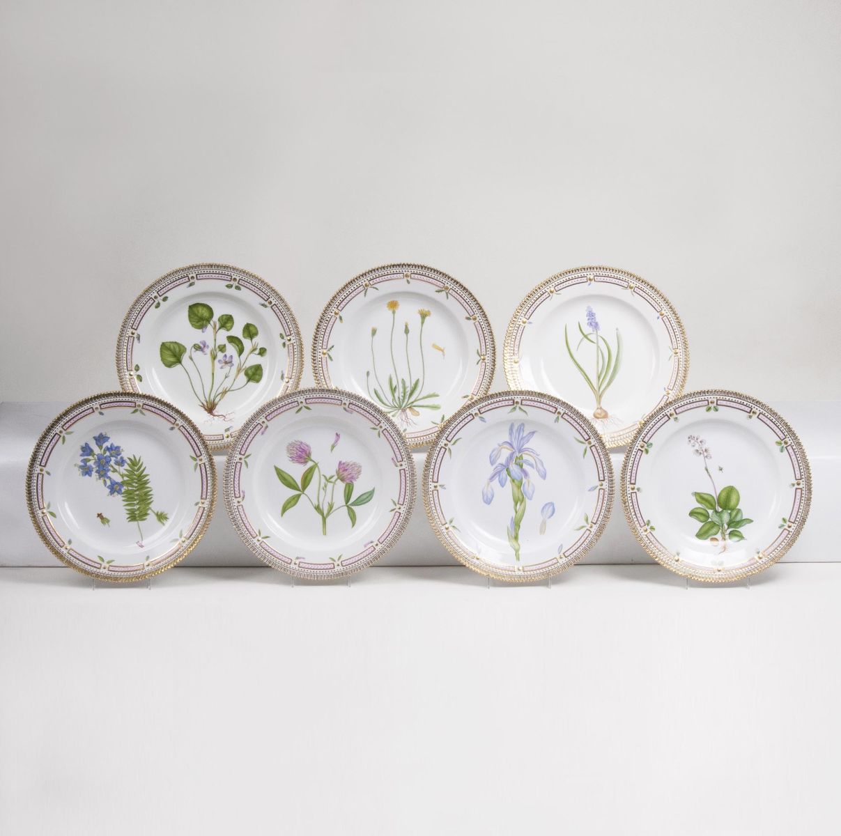 A Set of 7 Flora Danica Dinner Plates