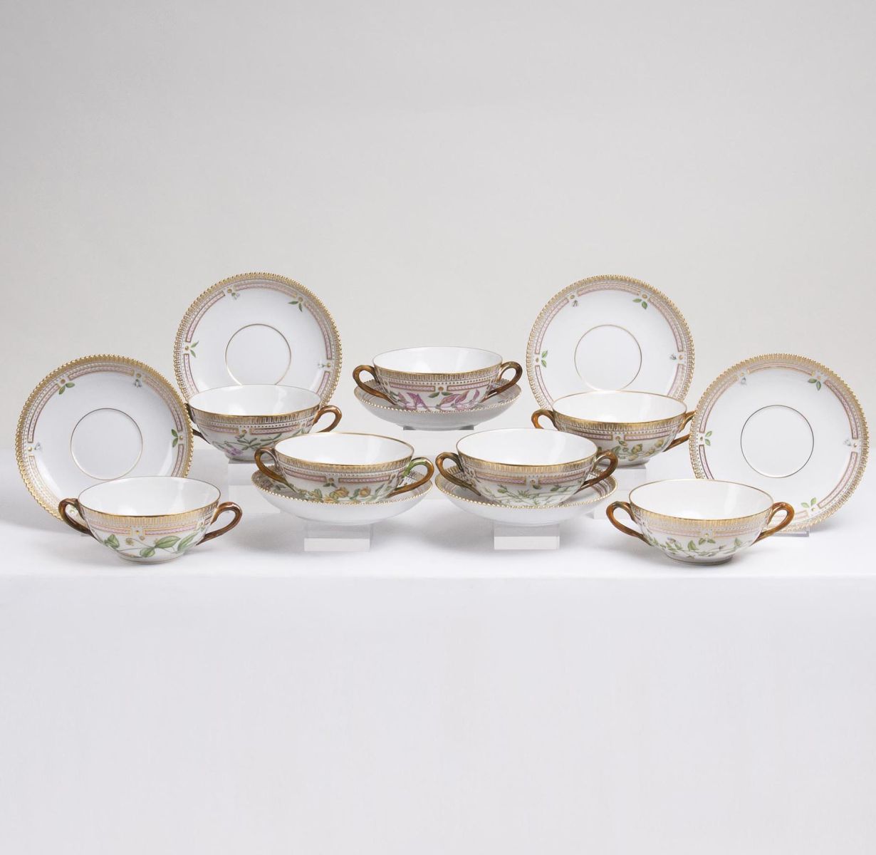 A Set of 7 Flora Danica Soup Cups with Saucers A Set of 7 Flora Danica Soup Cups with Saucers