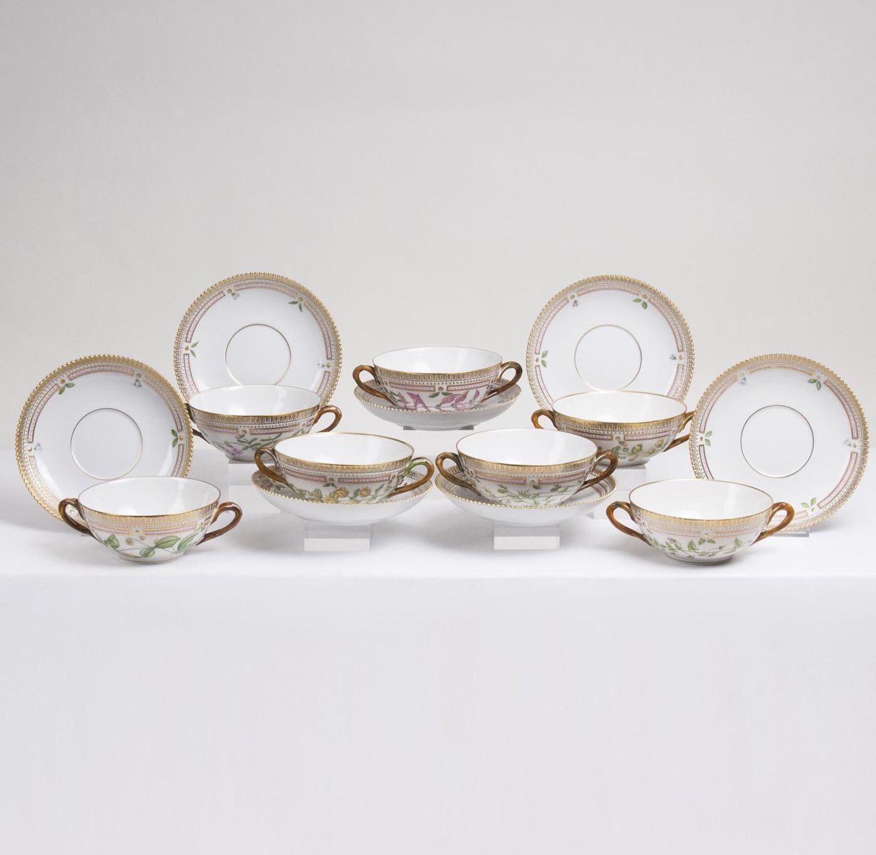 A Set of 7 Flora Danica Soup Cups with Saucers