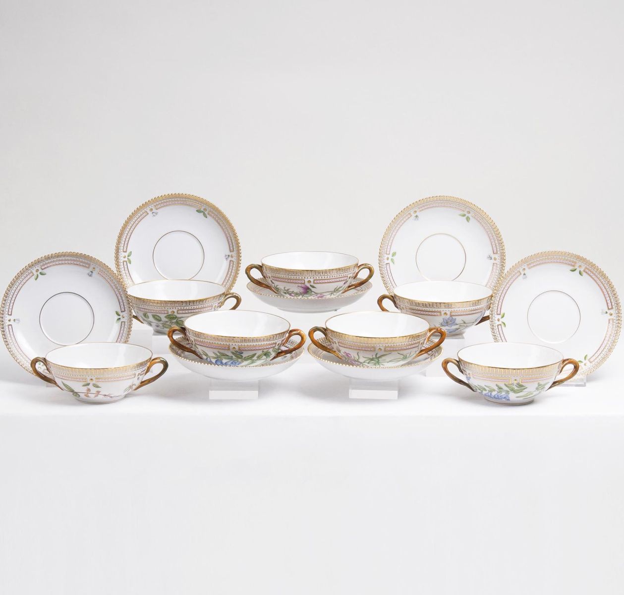 A Set of 7 Flora Danica Soup Cups with Saucers