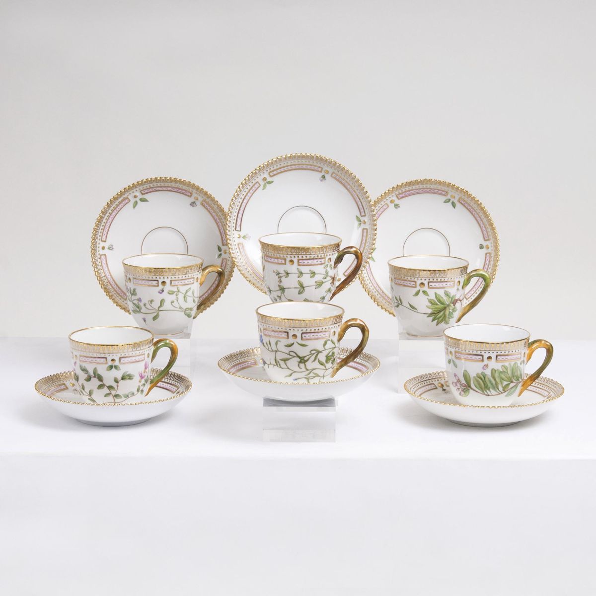 A Set of 6 Flora Danica Coffee Cups with 7 Saucers A Set of 6 Flora Danica Coffee Cups with 7 Saucers