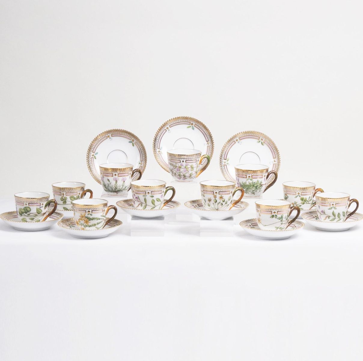 A Set of 11 Flora Danica Moccha Cups with 12 Saucers