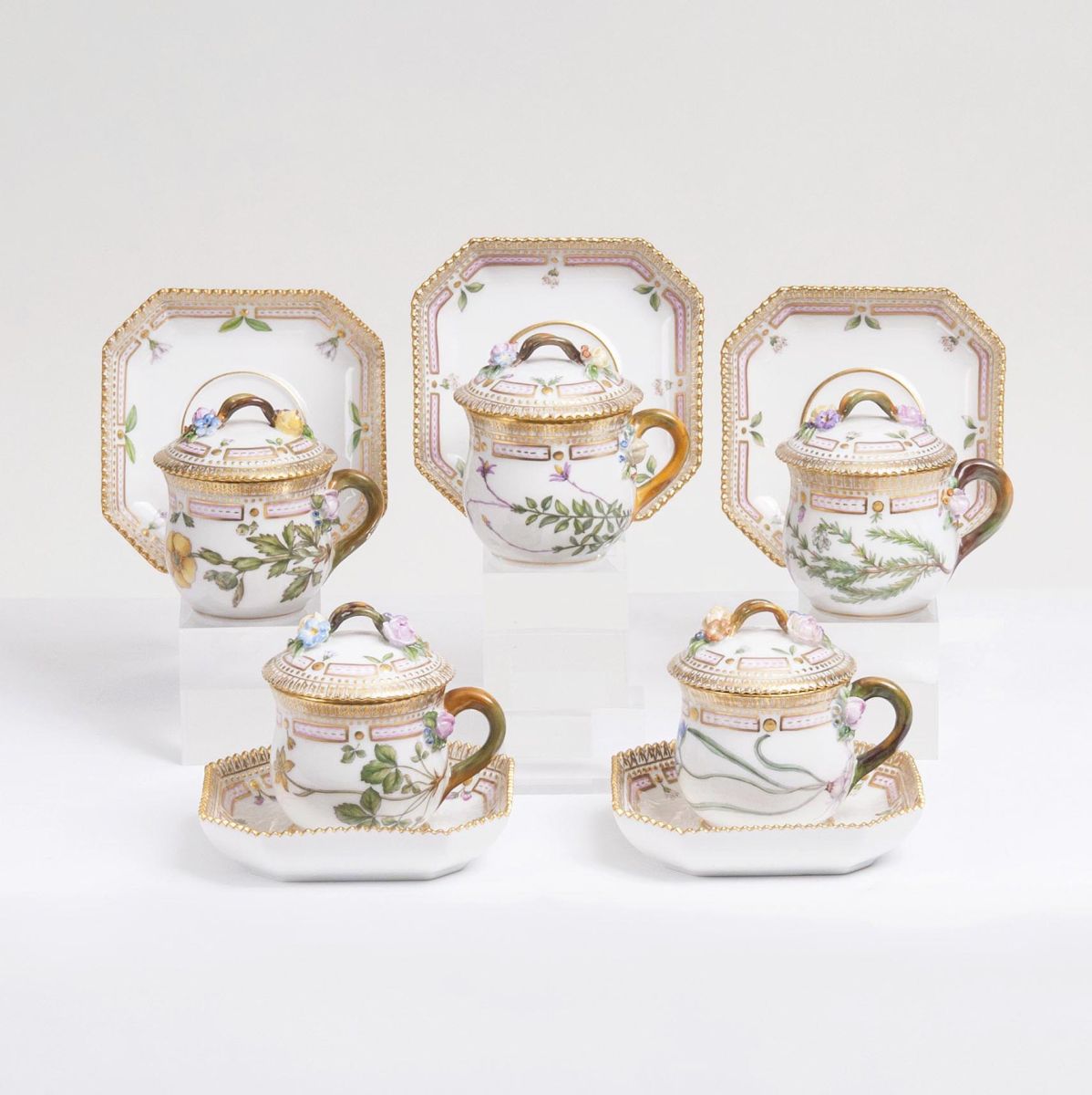 A Set of 5 small Flora Danica Lidded Bouillon Cups with Polygonal Saucers A Set of 5 small Flora Danica Lidded Bouillon Cups with Polygonal Saucers