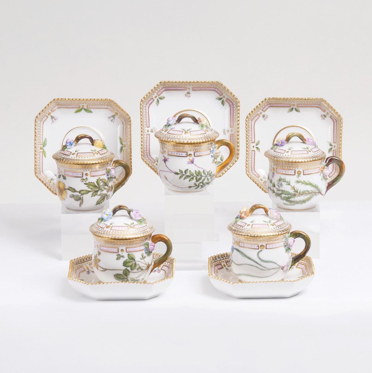 A Set of 5 small Flora Danica Lidded Bouillon Cups with Polygonal Saucers