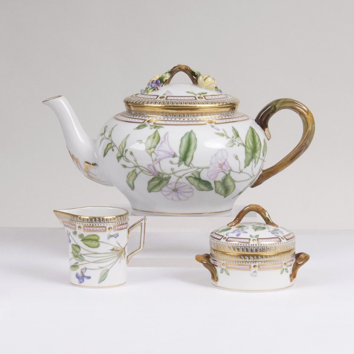 A Three-part Flora Danica Set of a Teapot, Milk Jug and Sugar Box A Three-part Flora Danica Set of a Teapot, Milk Jug and Sugar Box