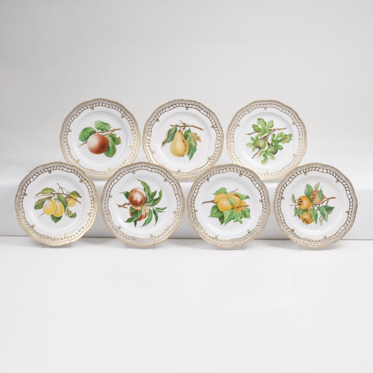 A Set of 7 reticulated Flora Danica Plates with Fruits