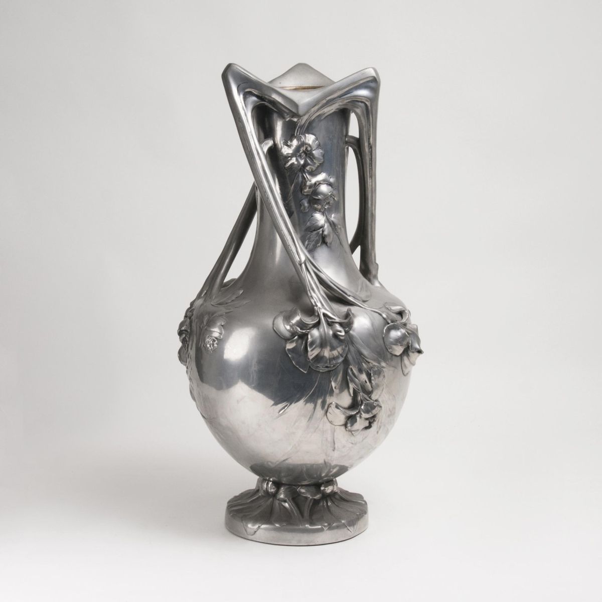 An imposing Art Nouveau Pewter Vase with Floral Decor An imposing Art Nouveau Pewter Vase with Floral Decor