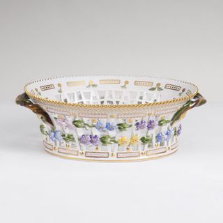 An oval reticulated Flora Danica Fruit Basket with Gooseberry Twig