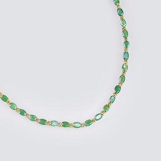 A Gold Necklace with Emeralds