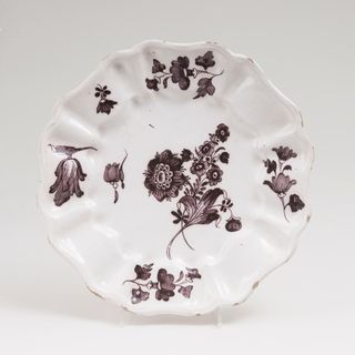 A Faience Plate with Manganese Flower Painting