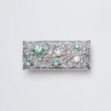 An Art-déco Diamond Brooch with Emeralds and Pearls