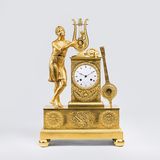 An Empire Pendule 'Orpheus singing of Love'