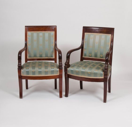 A Pair of Charles X Armchairs with Dolphin Decor