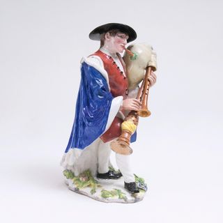 A rare Figure of a Savoyard Bagpiper