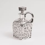 A precious antique Carafe with rich Silver Overlay