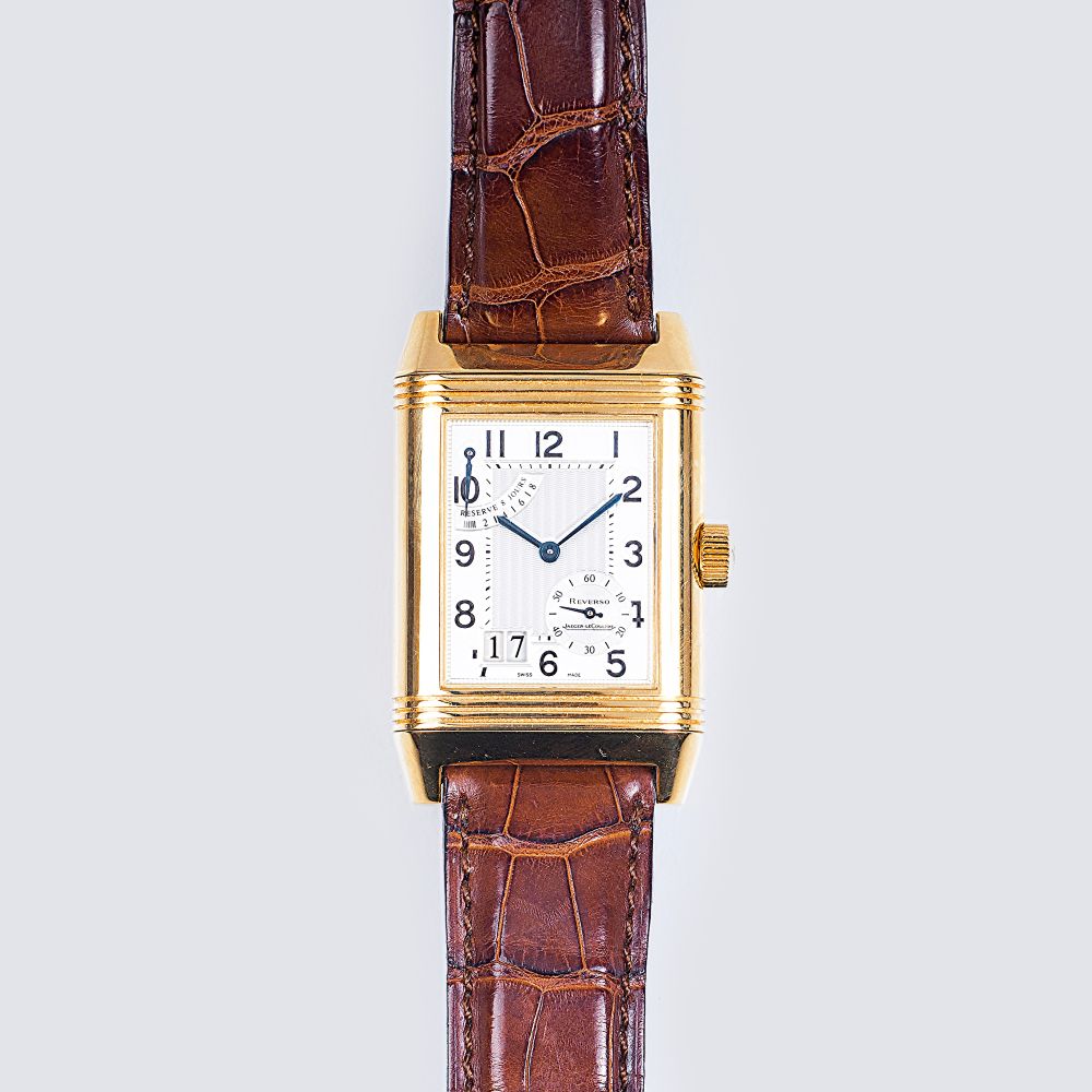 Große Herren-Armbanduhr  'Reverso' in Gelbgold mit Datum und Gangreserve