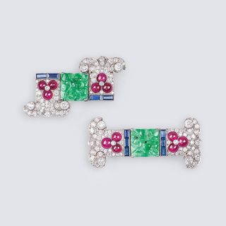 A Pair of Art-déco Diamond Clipbrooches with Rubies, Sapphires and Jade