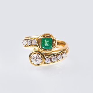 A Cross-Over Ring with Emerald and Diamonds