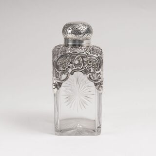 A Victorian Glass Decanter with Silver Mounting