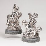 A Pair of silver plated group of figures 'Playing Putti' after Claude Michel Clodion
