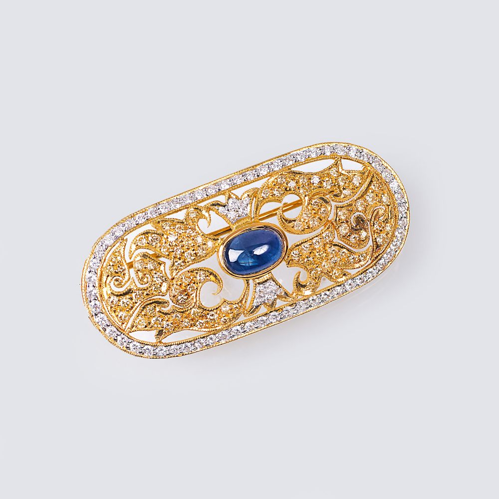 A Diamond Brooch with Sapphire Cabochon