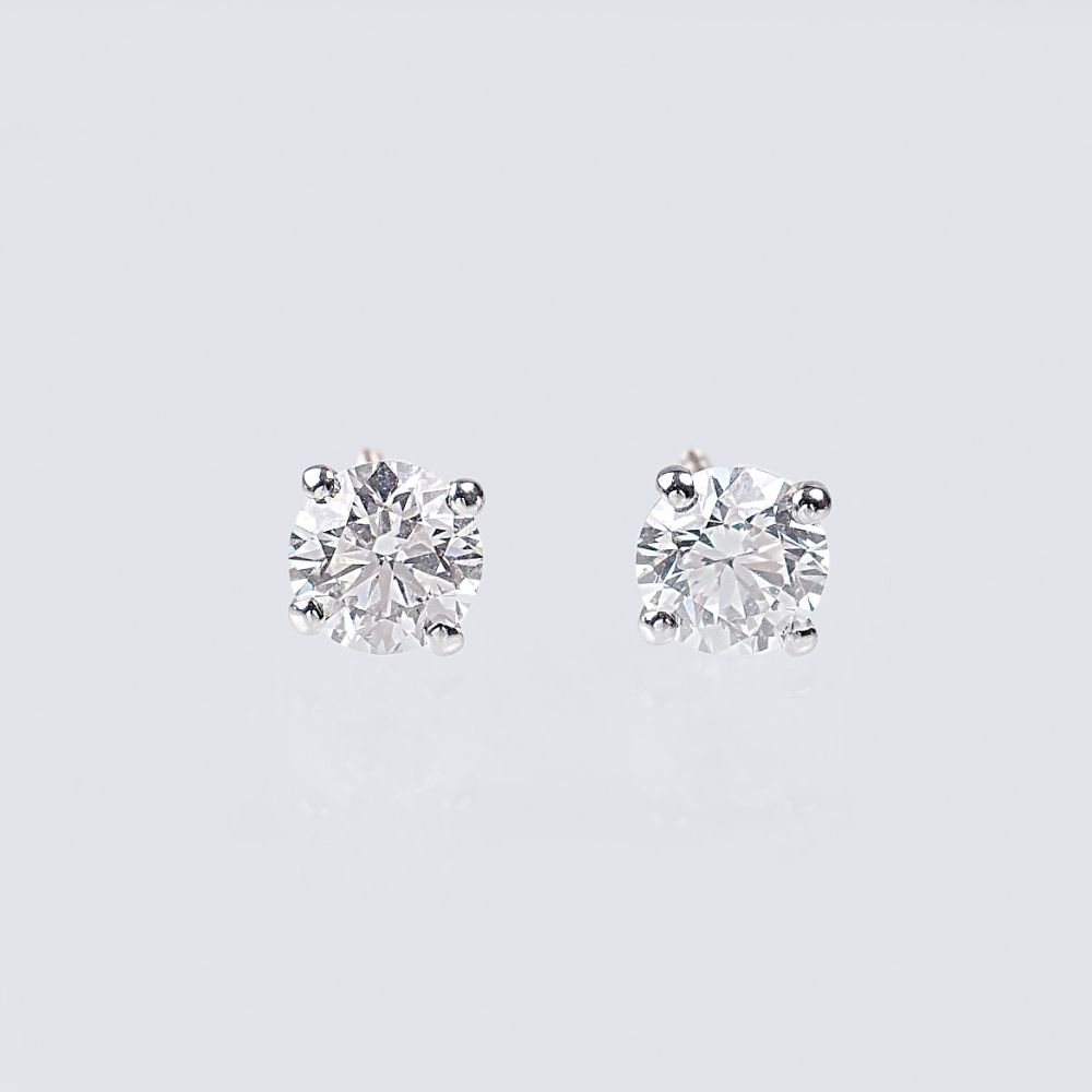 A Pair of Rare-White Solitaire Diamond Earrings