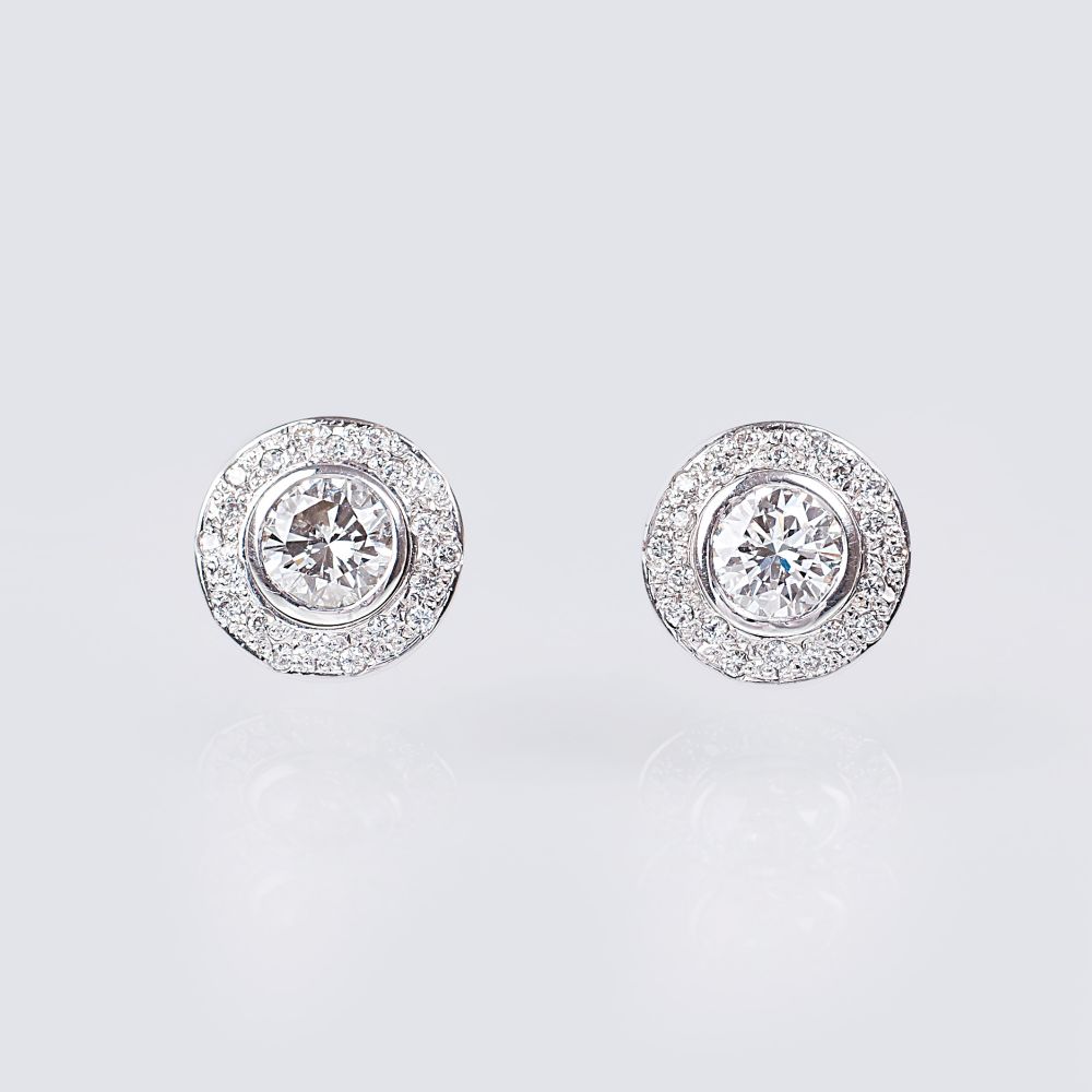 A Pair of Solitaire Diamond Earstuds with Diamonds - image 1