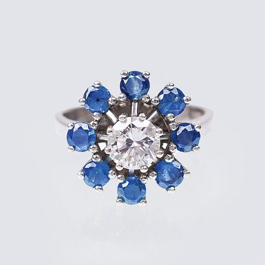 A Solitaire Diamond Ring with Sapphires