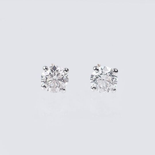 A Pair of Rare-White Solitaire Diamond Earrings