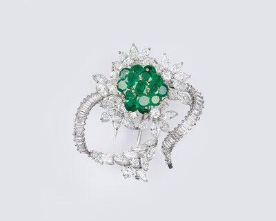 A Vintage Flower Brooch with Emeralds and Diamond