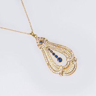 A Gold Pendant with Diamonds and Sapphires on Necklace