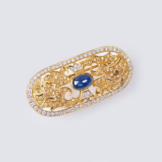 A Diamond Brooch with Sapphire Cabochon