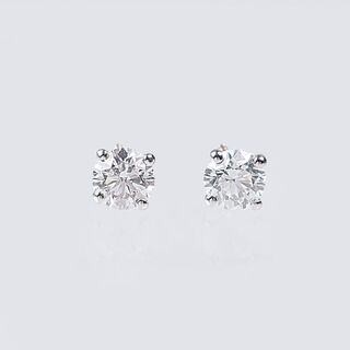 A Pair of Rare-White Solitaire Diamond Earrings