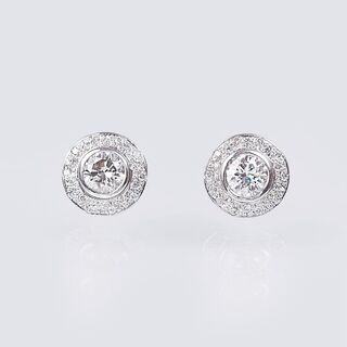 A Pair of Solitaire Diamond Earstuds with Diamonds