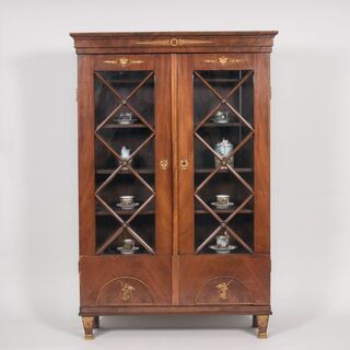 An elegant Empire Glass Cabinet