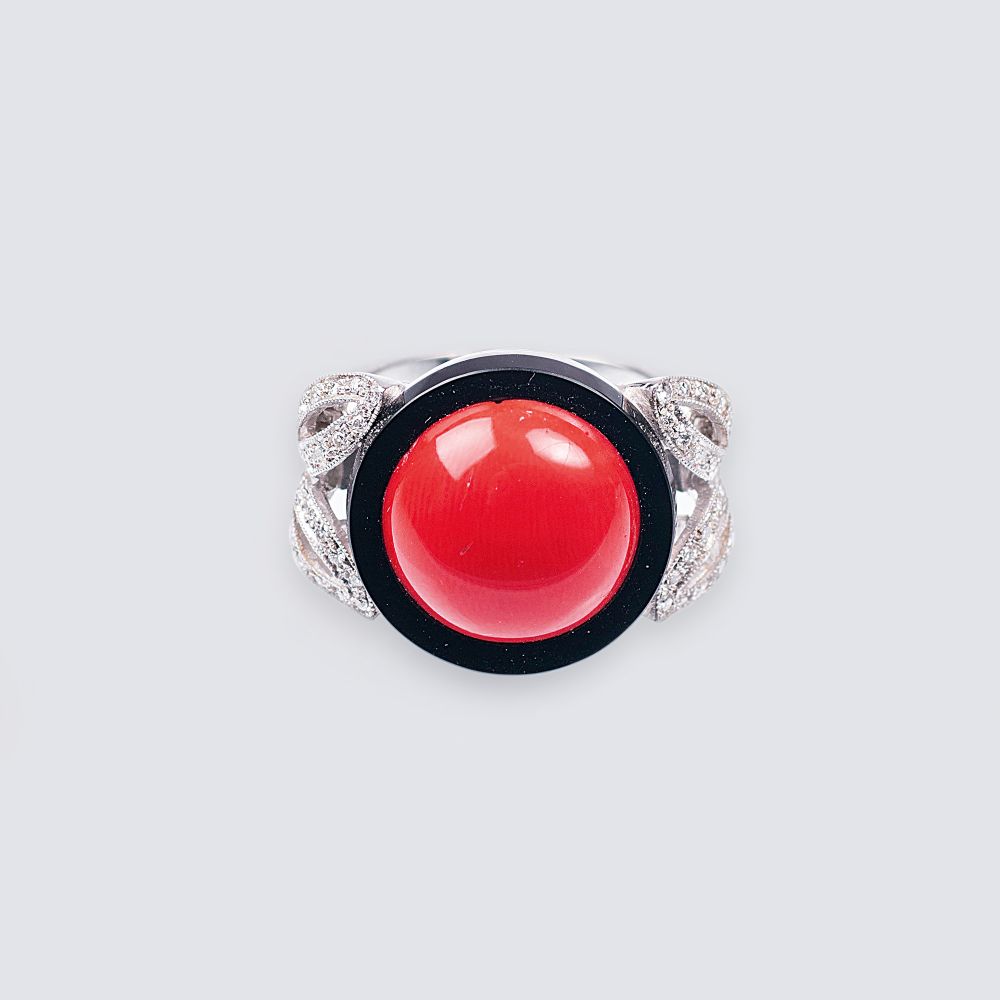 A Ring with Coral, Onyx and Diamonds