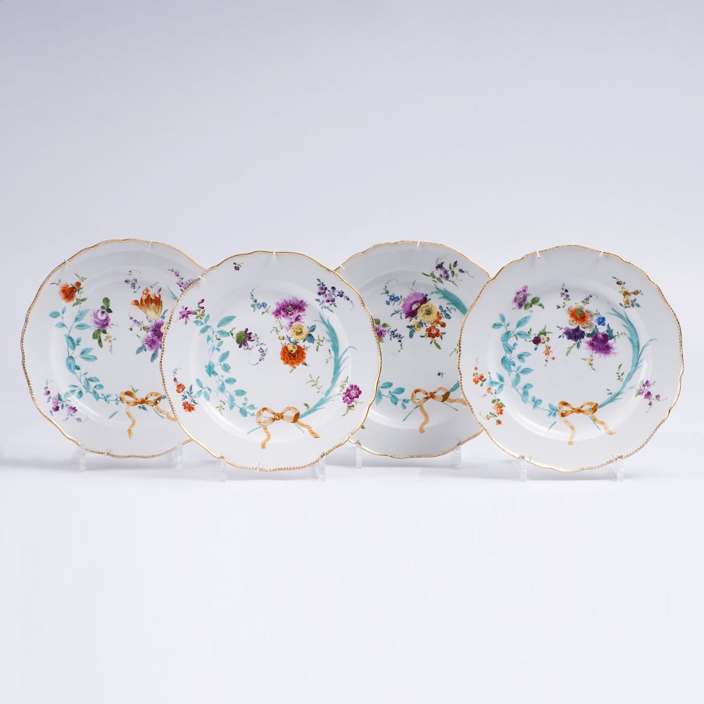 A Set of 4 Plates with Flowers and Garlands