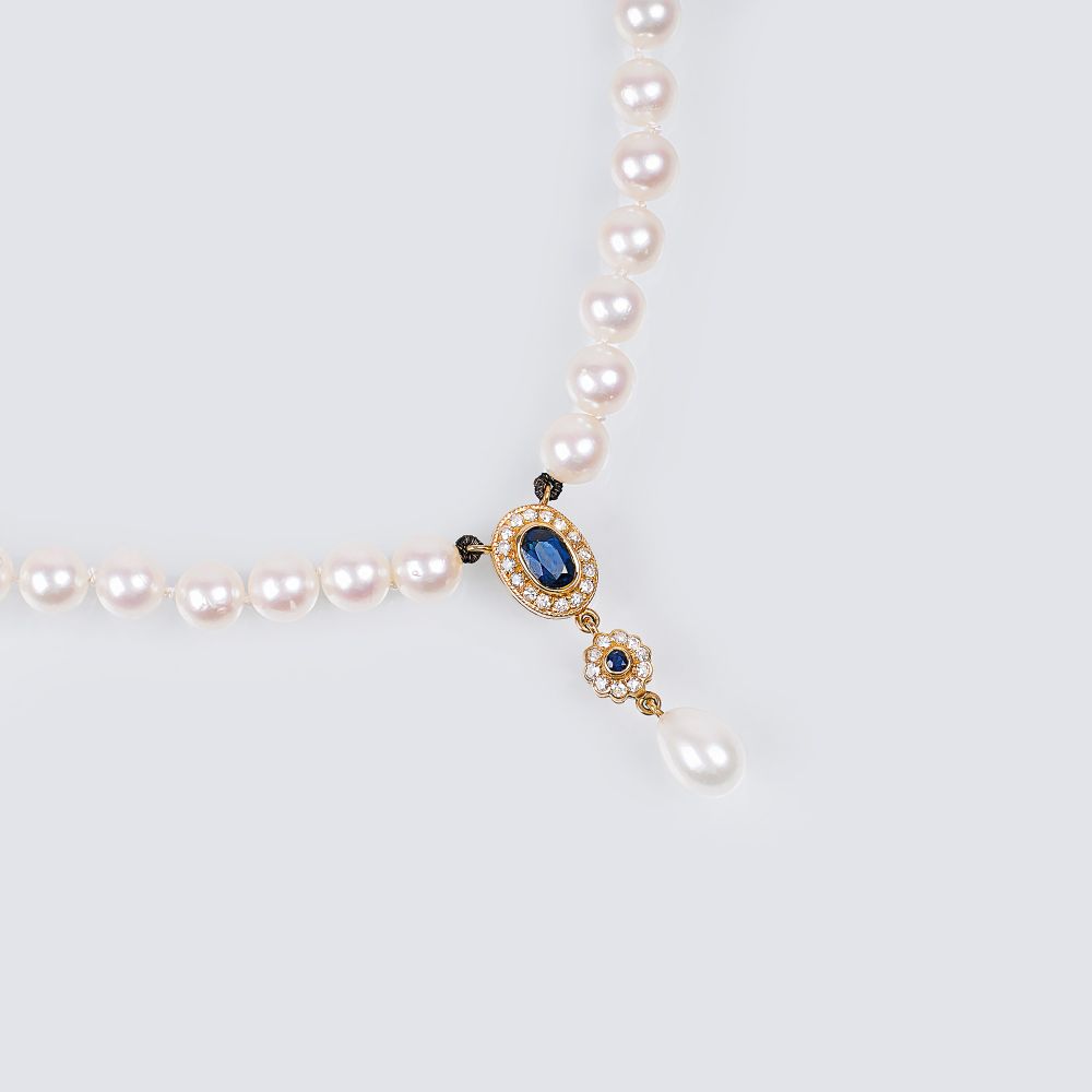 A Pearl Necklace with Sapphire Diamond Pendant A Pearl Necklace with Sapphire Diamond Pendant