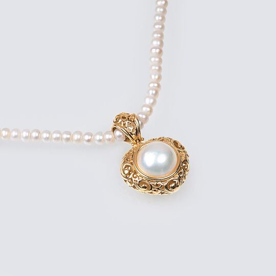 A Pearl Necklace with Mabé Pearl Pendant