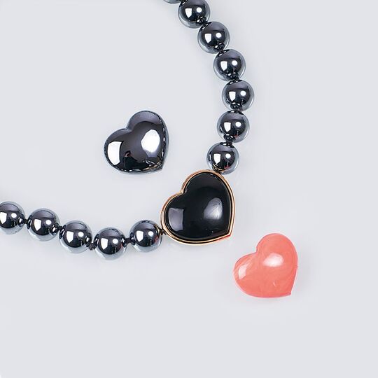 A Necklace with Faux Pearls and Heart Clasps