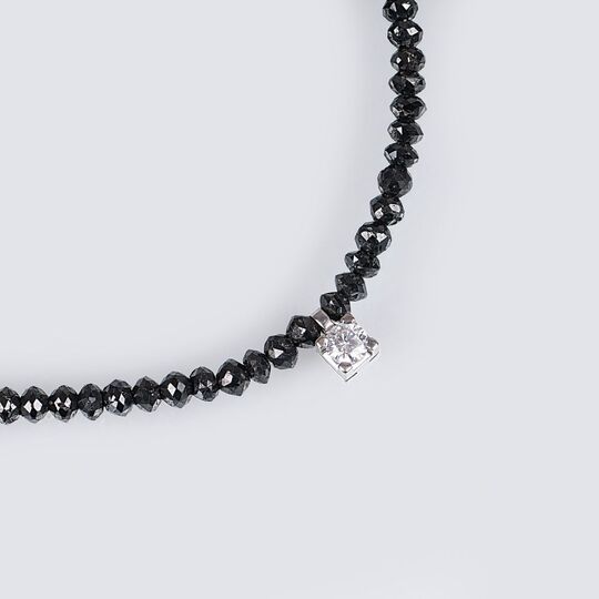 A Black Diamond Necklace with Solitaire Diamond