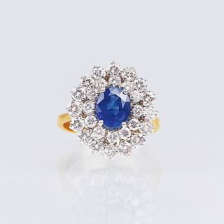 A very fine Diamond Ring with natural Sapphire