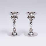 A Pair of Candleholders with Grabe Decor