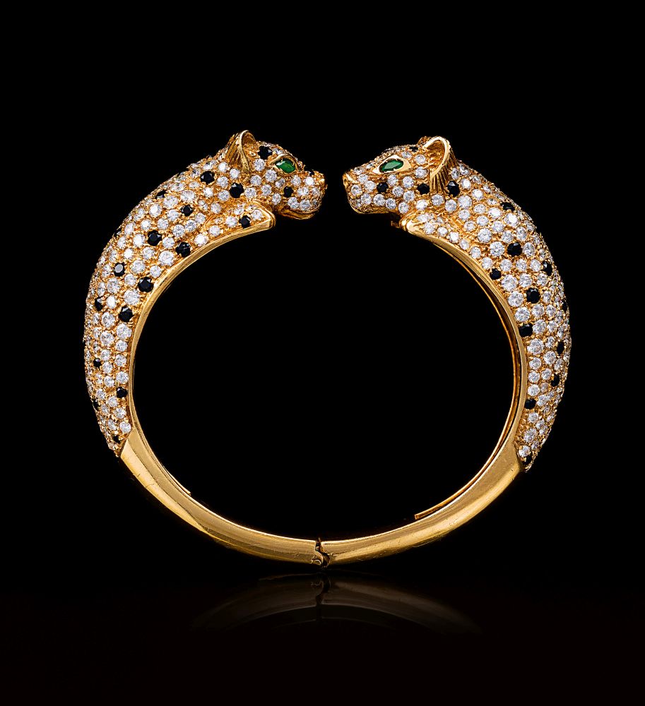 Exzellenter Panther-Armreif mit Brillanten und Smaragd-Augen Exzellenter Panther-Armreif mit Brillanten und Smaragd-Augen
