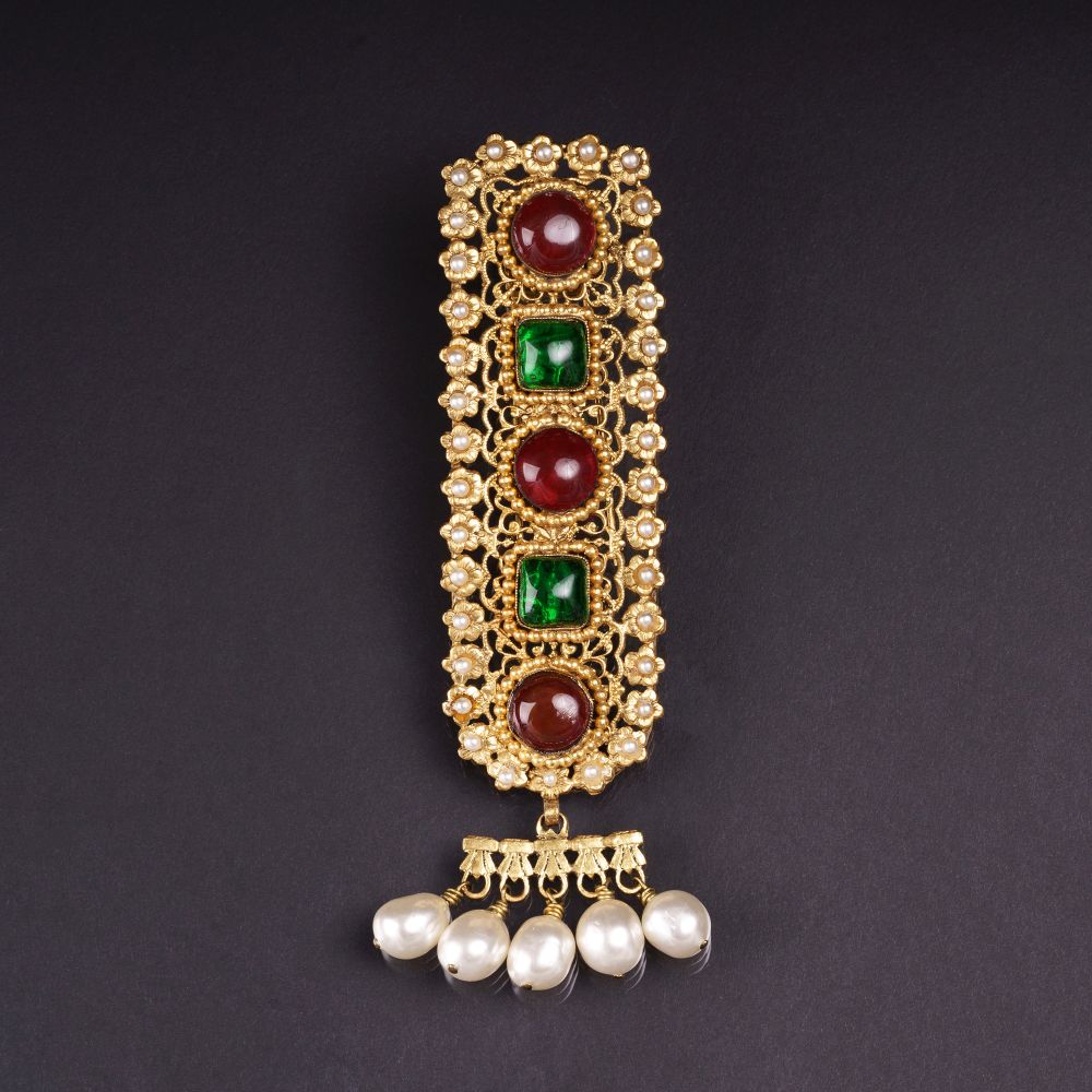 Chanel - A Gripopix Brooche with Faux Pearls A Gripopix Brooche with Faux Pearls