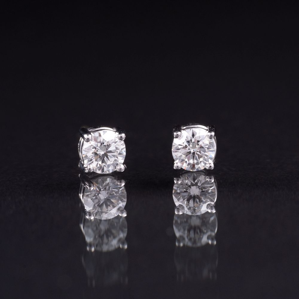 A Pair of Rare-White Solitaire Earstuds A Pair of Rare-White Solitaire Earstuds